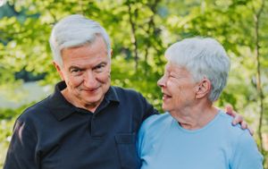 An older couple shares a funny moment during a photo session in Topsham, Maine.