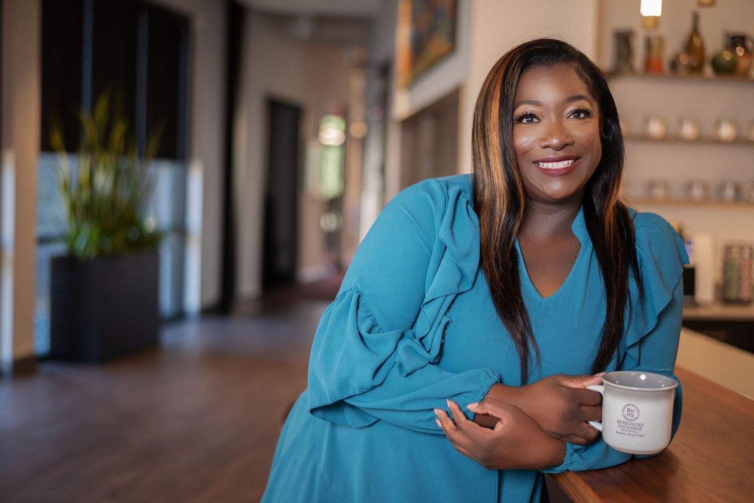 Branding photo of a female entrepreneur with her product line in Evans, GA