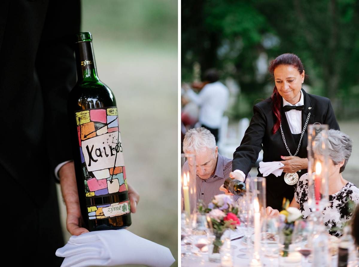 Wedding reception service featuring artisanal wine bottles and fine dining experience.