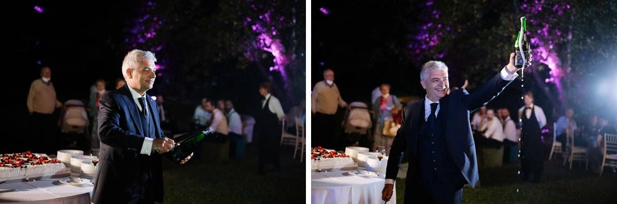 Wedding reception setup at dusk with purple accent lighting and elegant table settings.