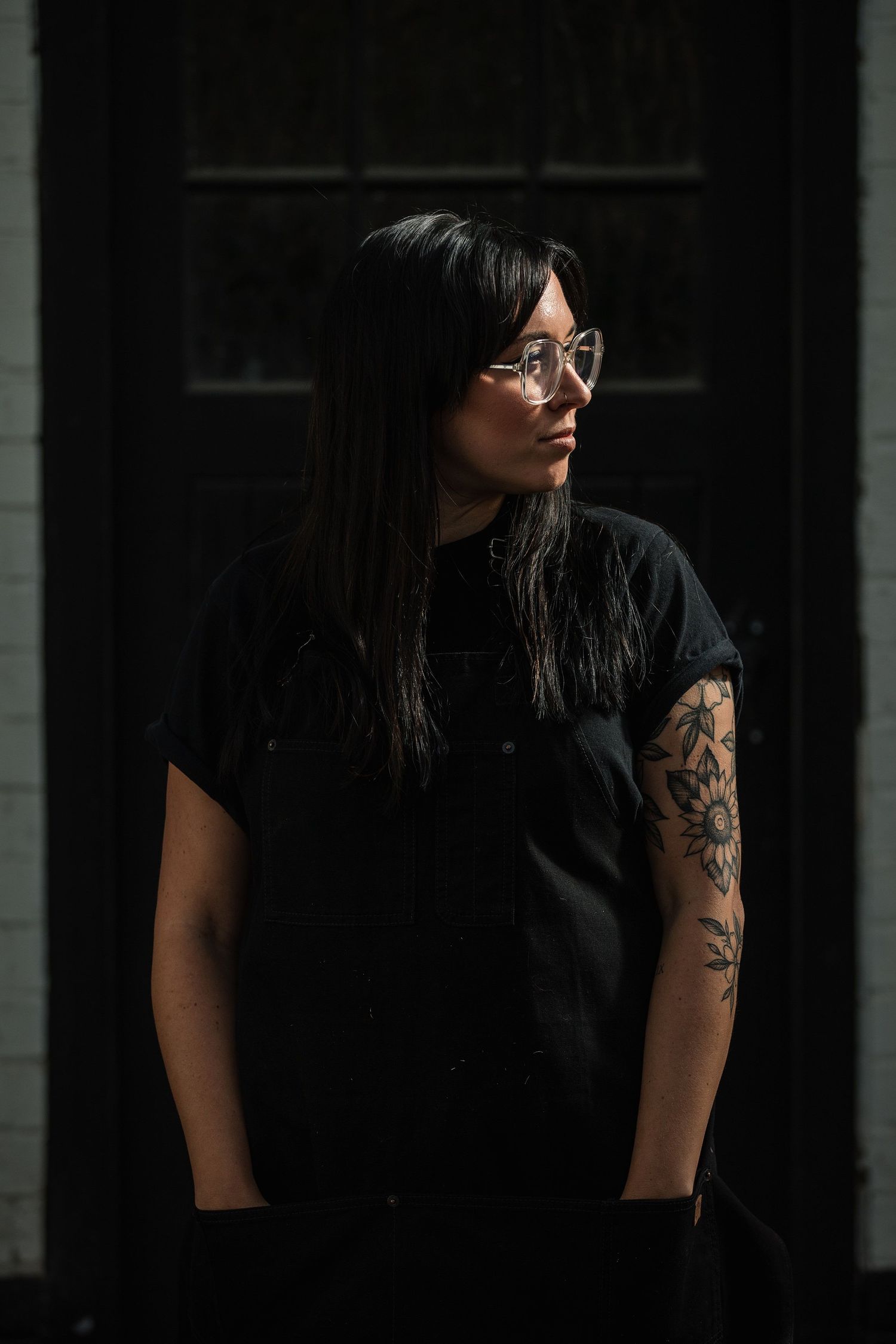 Brand Photographer in Hertfordshire Becky Harley Creative Annie on brand shoot wearing black in front of black door