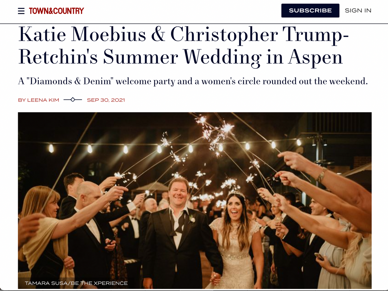 Newspaper article headline featuring wedding announcement with sparkler celebration photo.