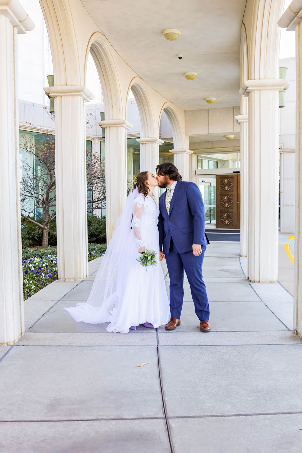 A couple kissing at the Bountiful Temple