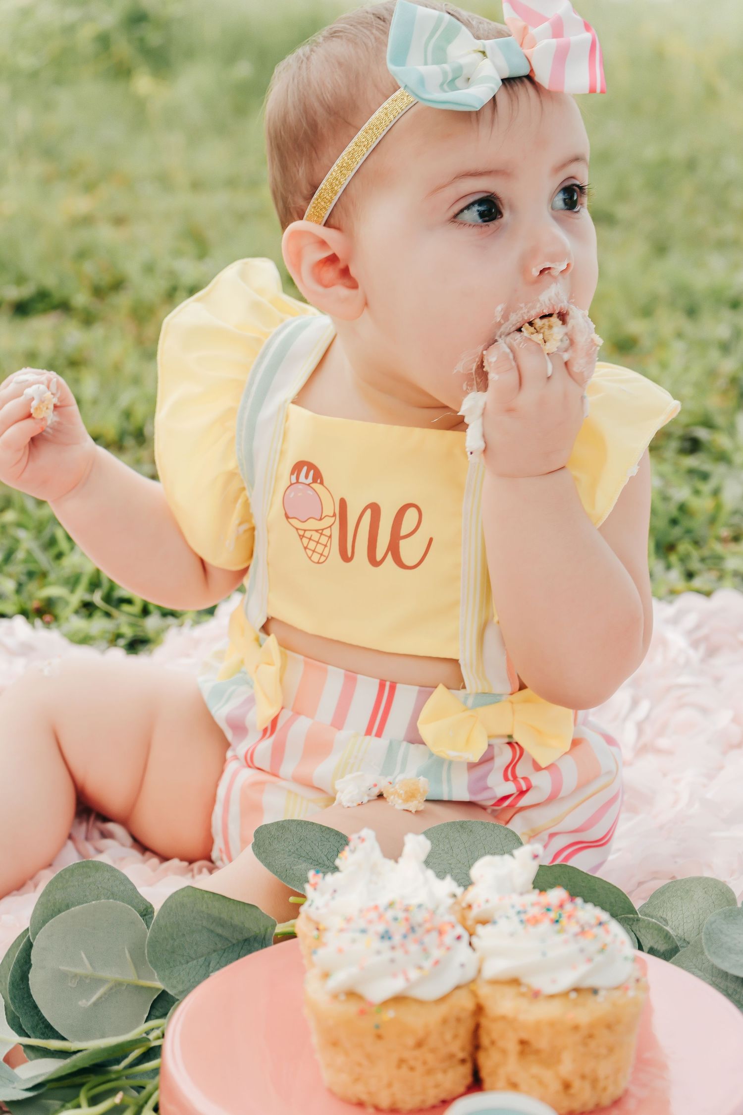 Outdoor Cake Smash Session at Maximo Park in St. Pete, FL; baby eating cupcakes