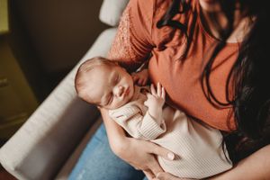 Intimate indoor portrait session with soft window lighting.