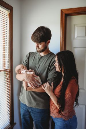 Family portrait session in bright room with natural window light.