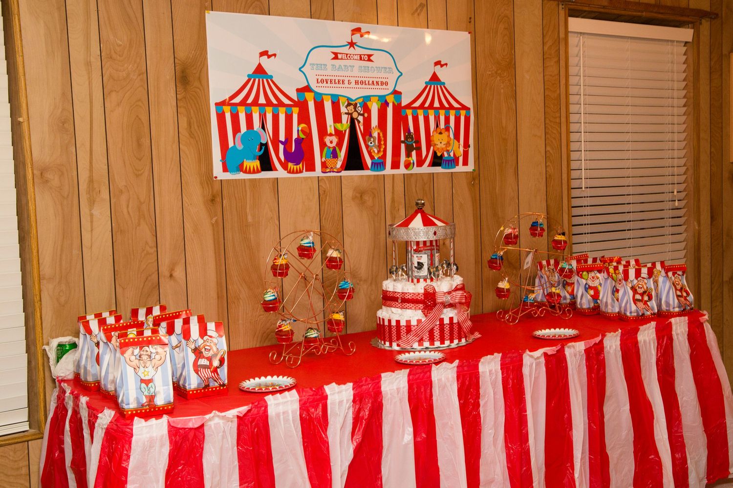 Carnival themed party setup with red and white striped decorations and tent motifs.