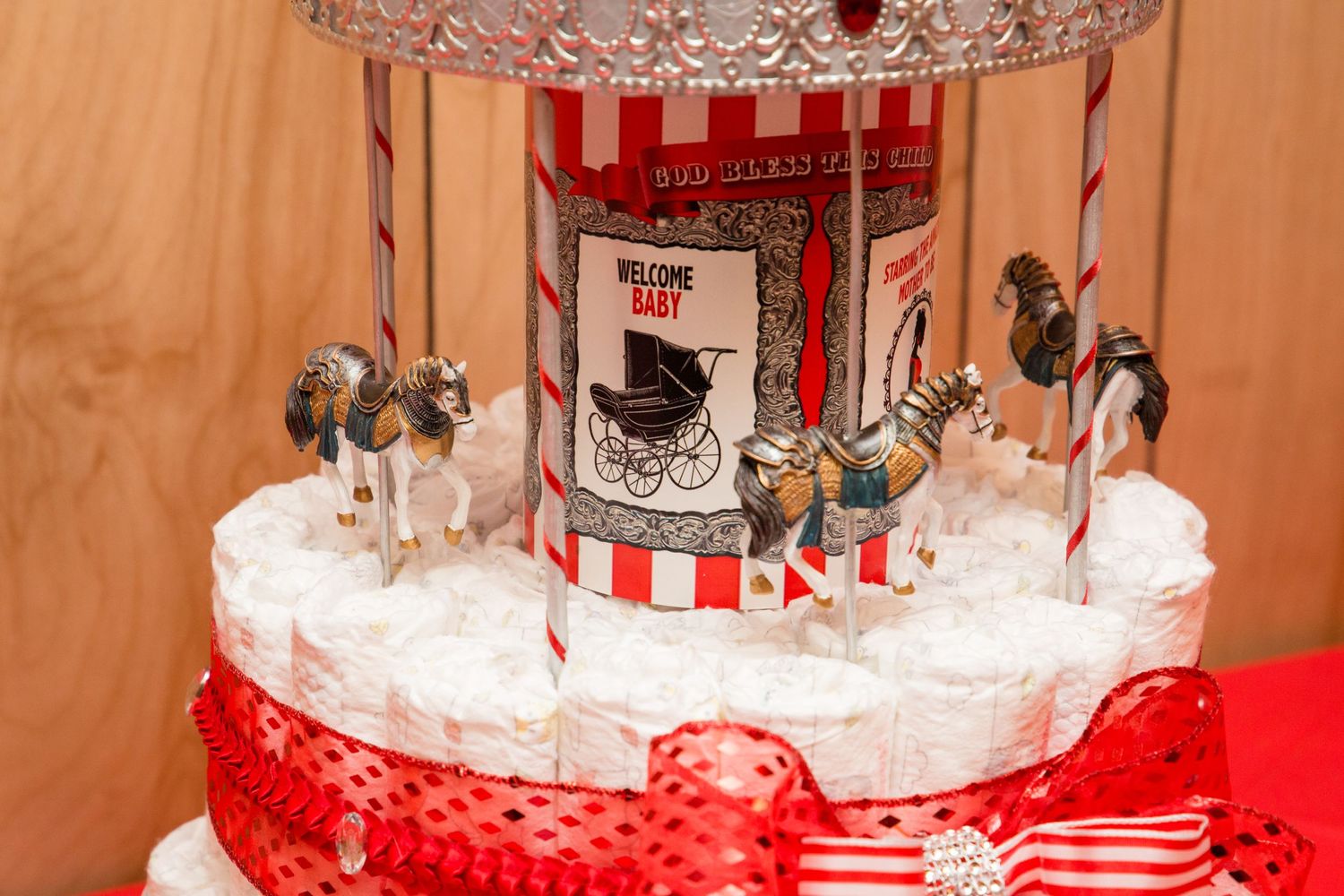 Multiple angles of a red and white carnival-themed centerpiece with vintage circus illustrations.