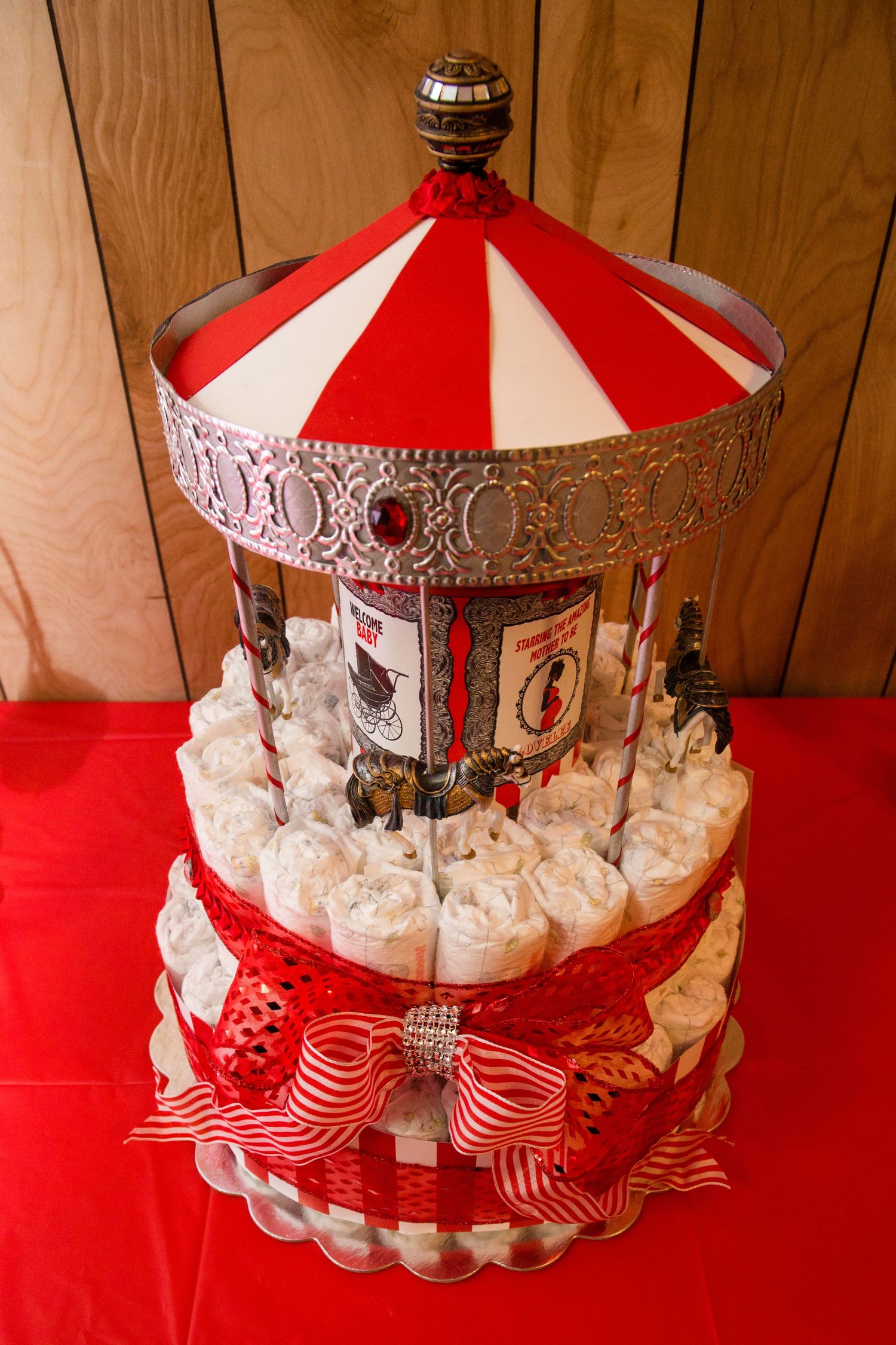 A decorative carousel-style centerpiece with red and white stripes and silver embellishments.