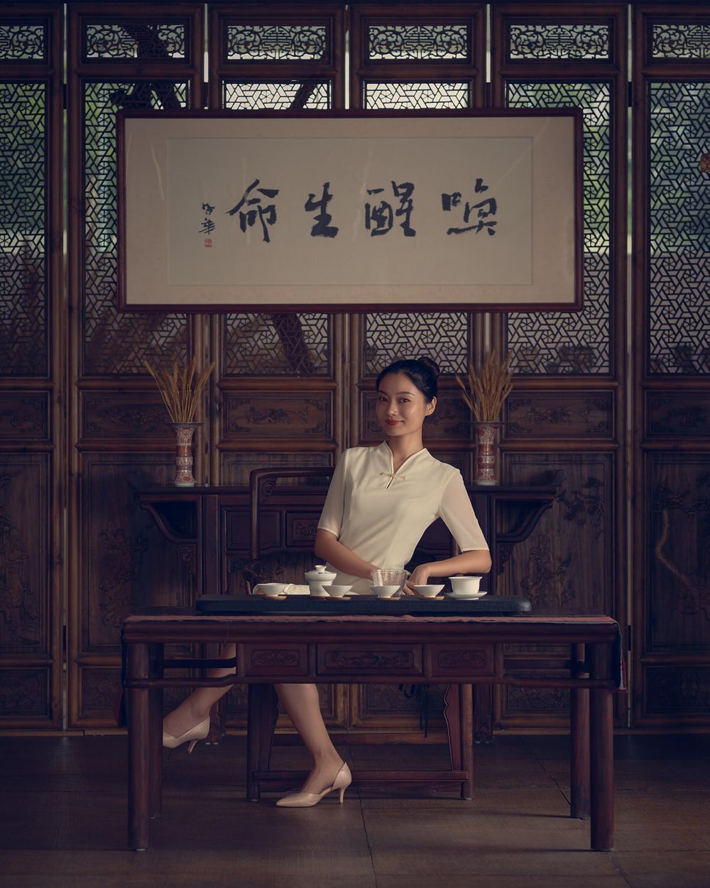 Young female teacher sits for school yearbook legacy portrait elegant timeless tradition painterly style chiaroscuro