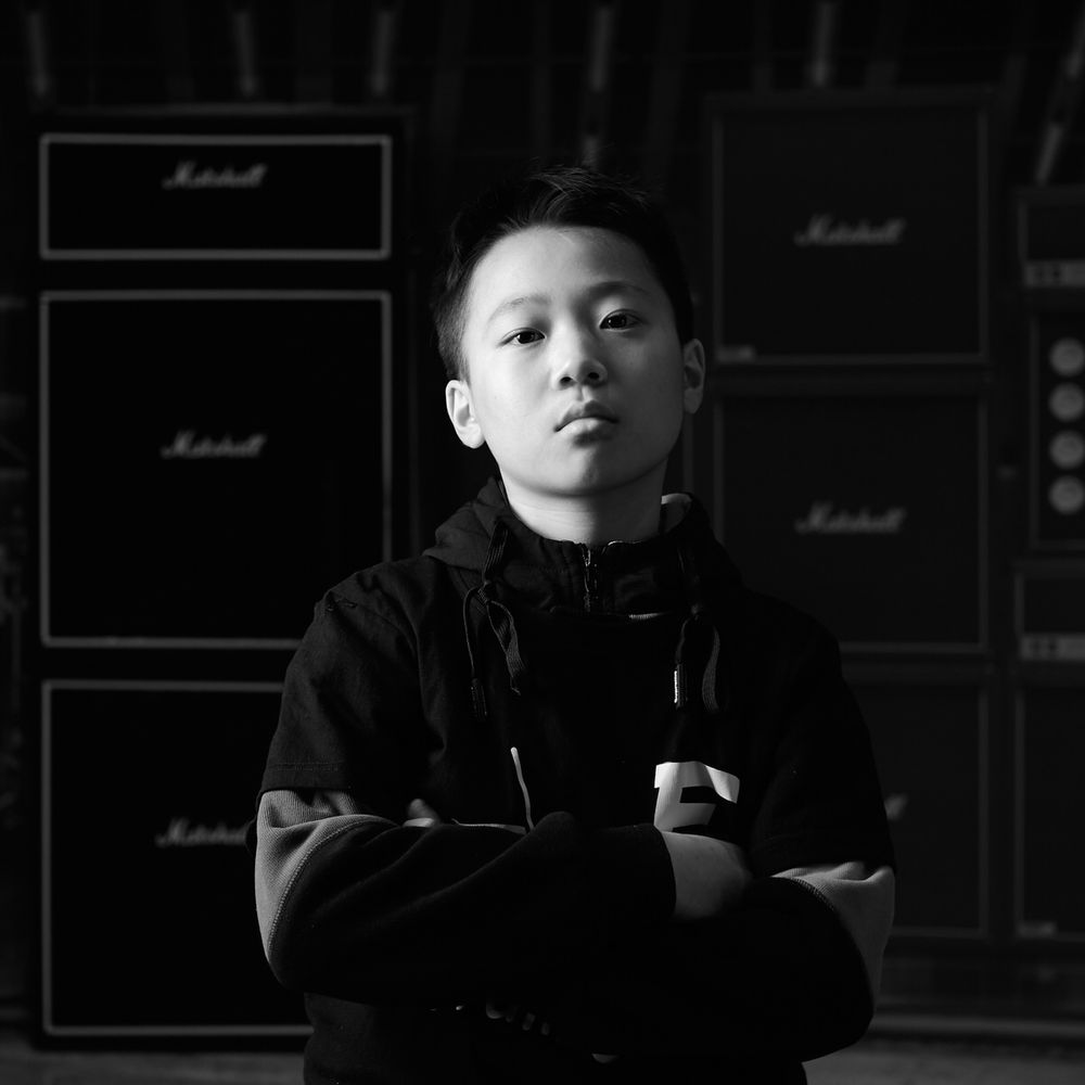timeless portrait of tough guy drummer young student of e-drum school Zhuhai China