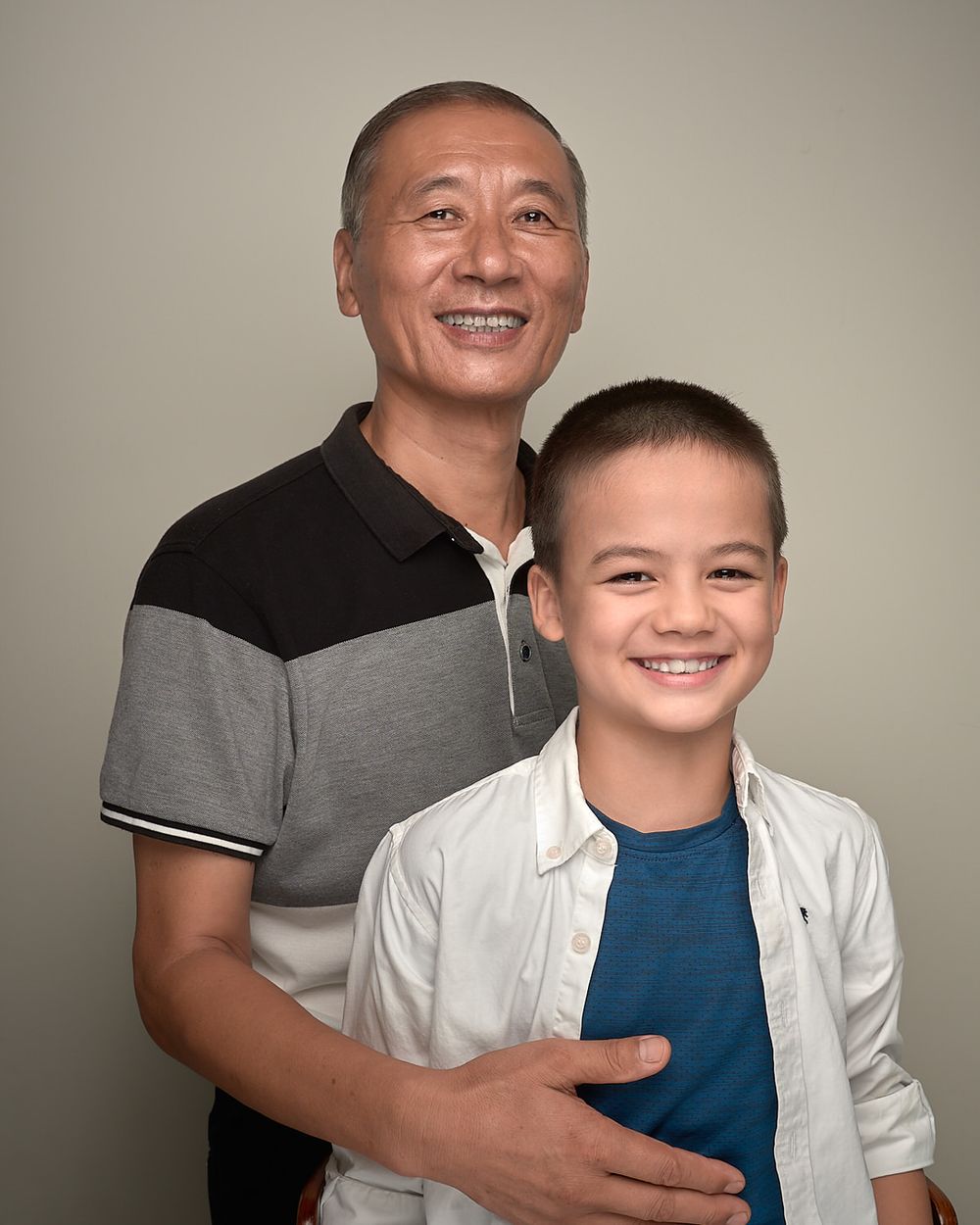 Family portrait grandfather grandson smiling portraitsLegacy portrait elegant timeless tradition