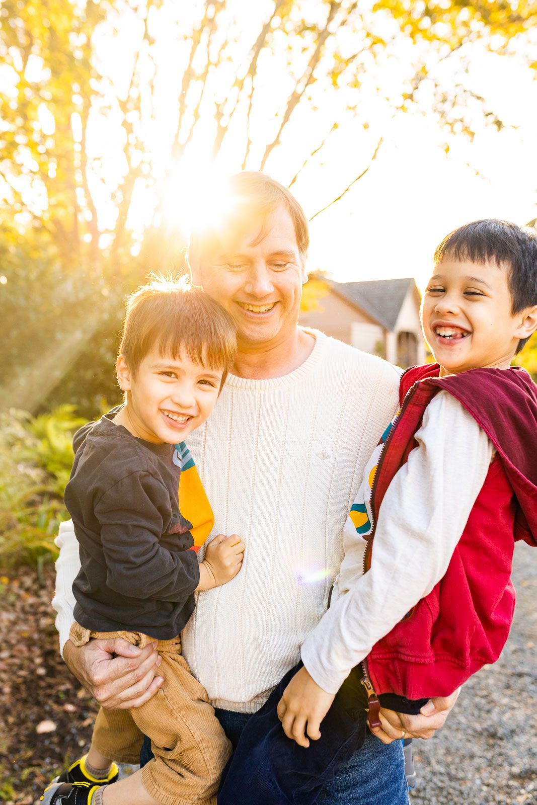 Backlit portrait of a father with his sons in Bellevue