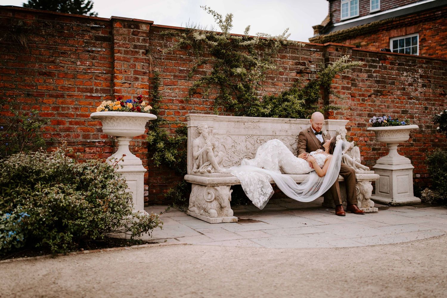 Bowburn Hall, Durham wedding couple sat in wall. garden