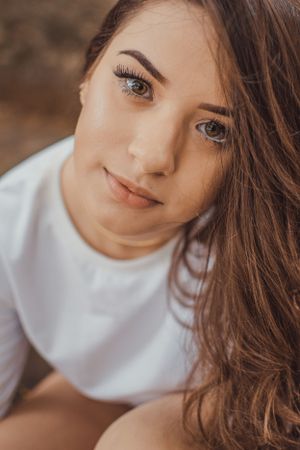 Close-up beauty portrait with natural makeup and soft lighting.