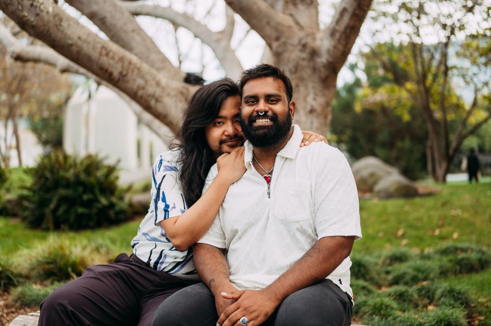 Same sex engagement at Yerba Buena Gardens with interracial couple.