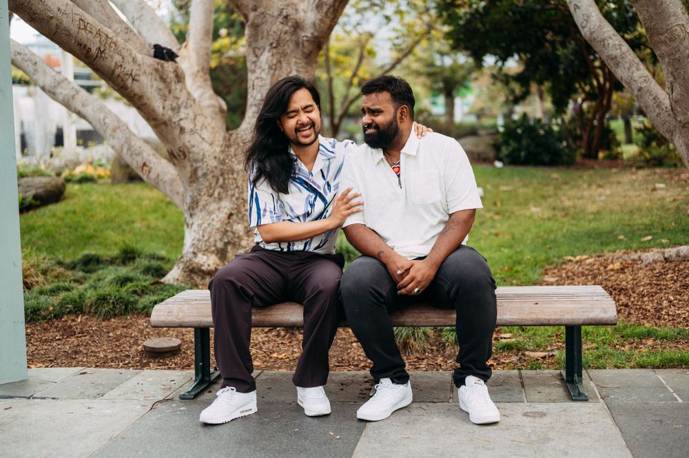 Same sex engagement at Yerba Buena Gardens with interracial couple.
