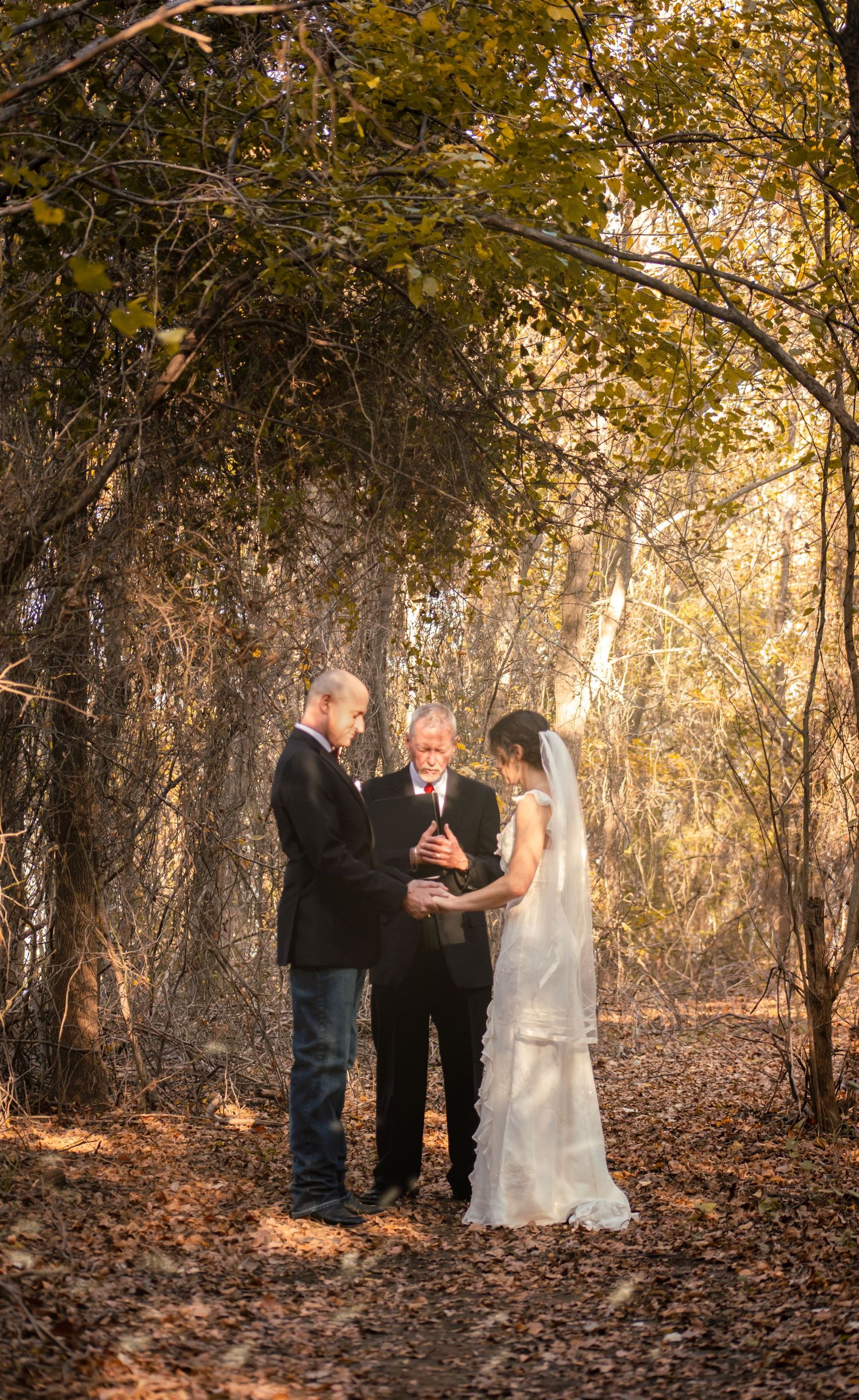 Rustic wedding in the woods with off white dress and a nature backdrop at Willow Grove Park in Lake Dallas