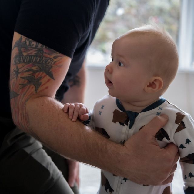 Parent holding young baby looking at each other, family portrait, North Vancouver photographer