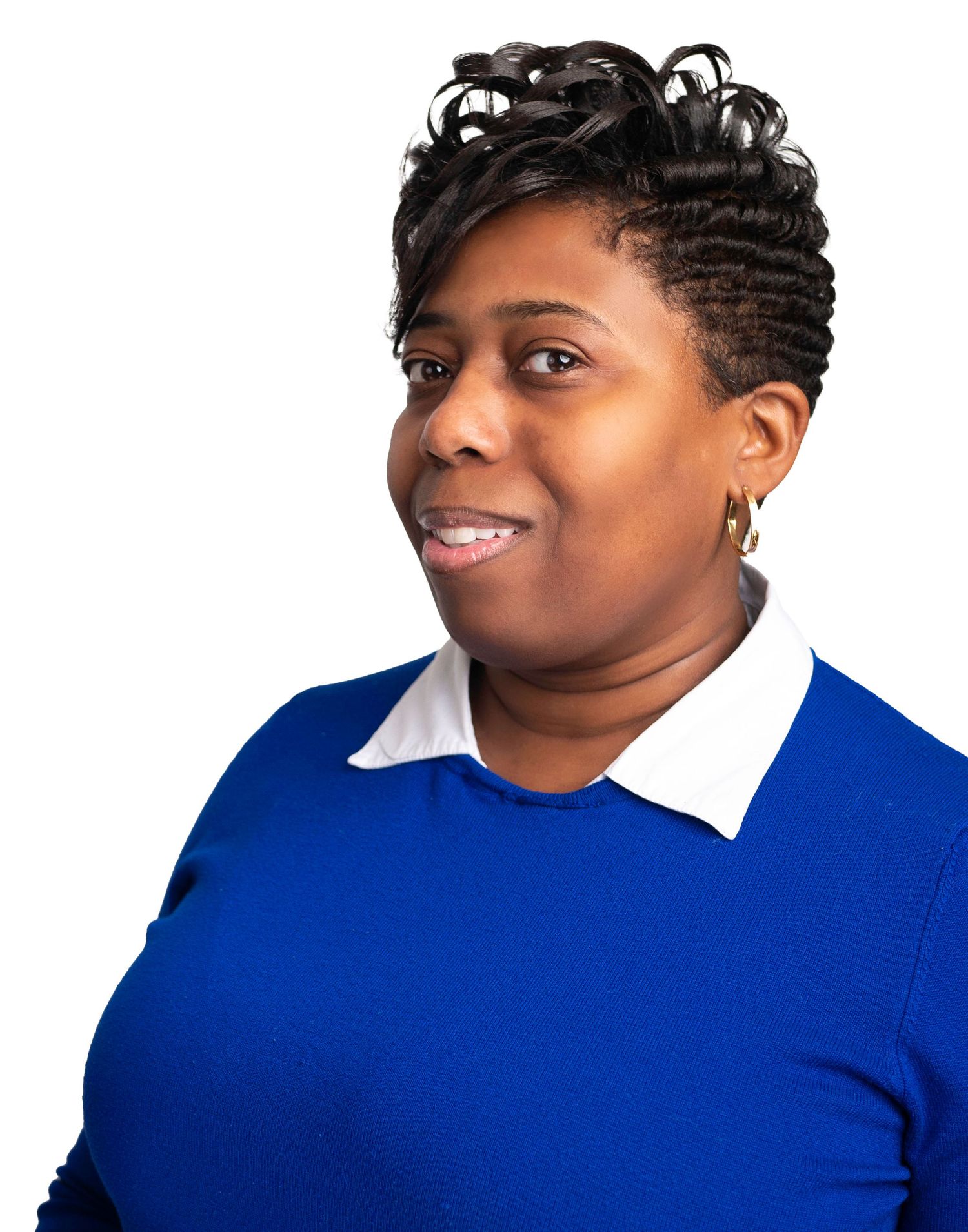 Professional portrait with person in blue sweater and white collar against white background.