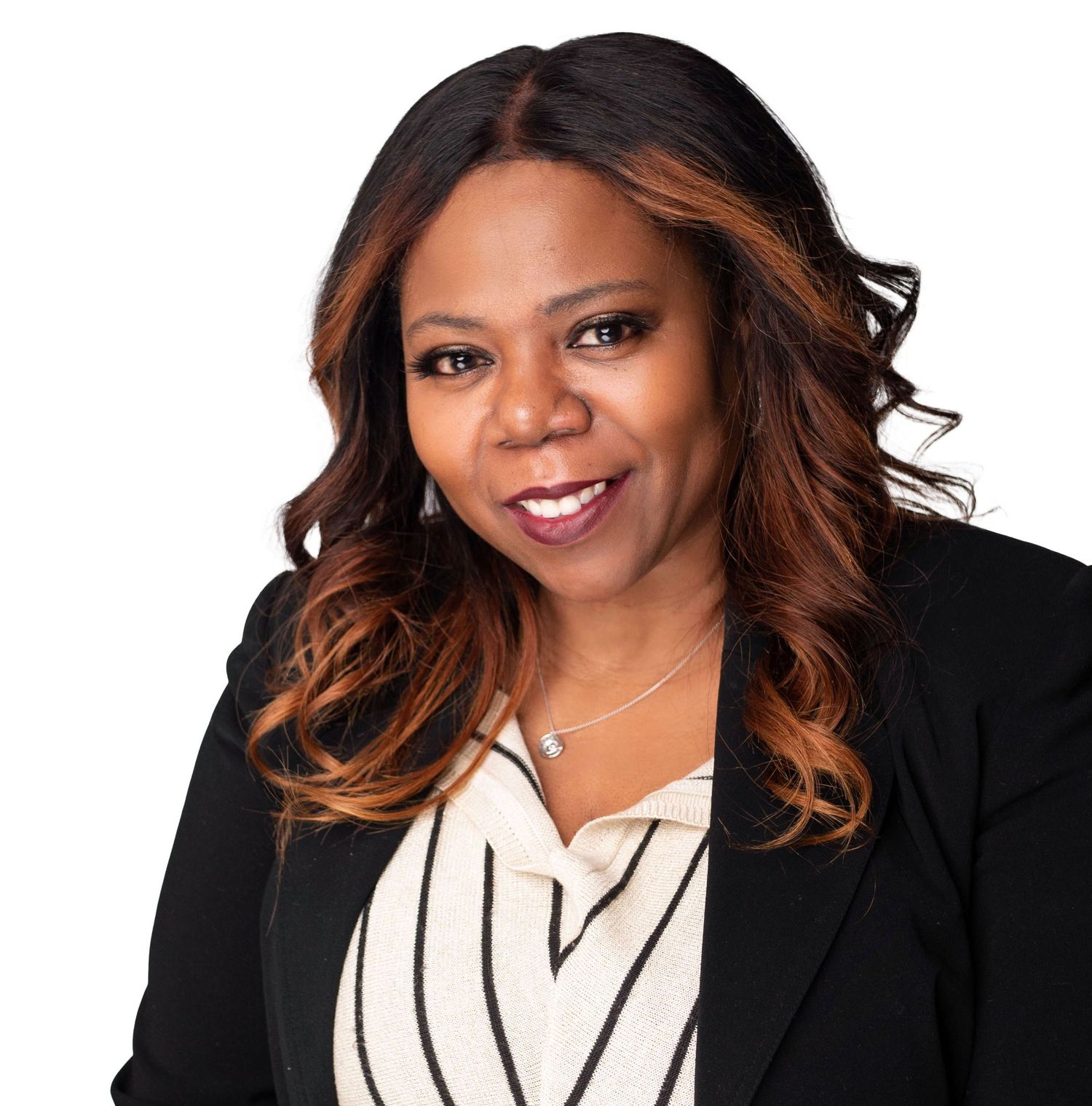 Professional headshot with person in black blazer and striped blouse.