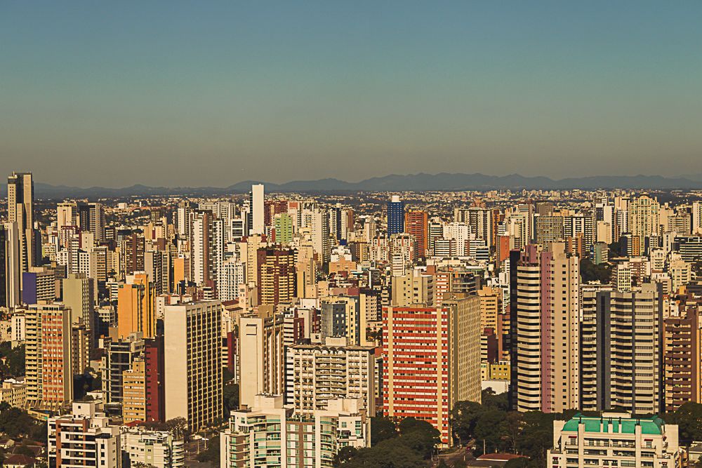 Aerial city view at golden hour with urban landscape, photographed by Piret Victoria Ribas.