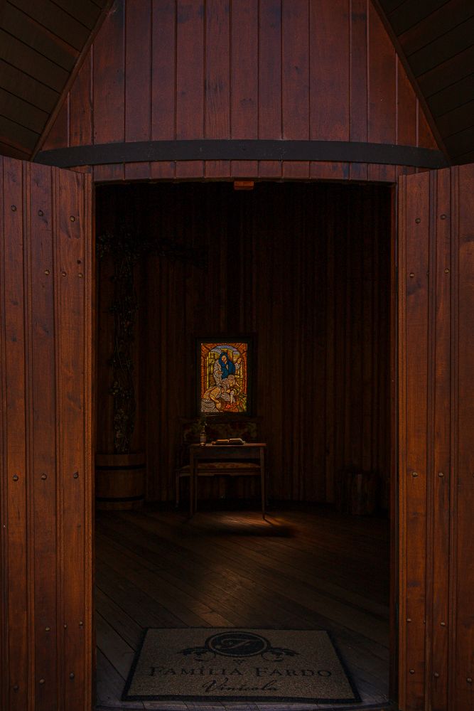 Interior view of small wooden chapel with icon, photographed by Piret Victoria Ribas.