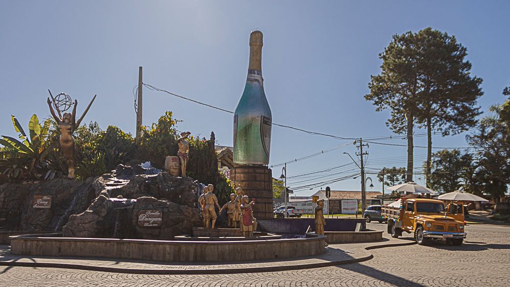 Large wine bottle monument roundabout in urban setting, photographed by Piret Victoria Ribas.