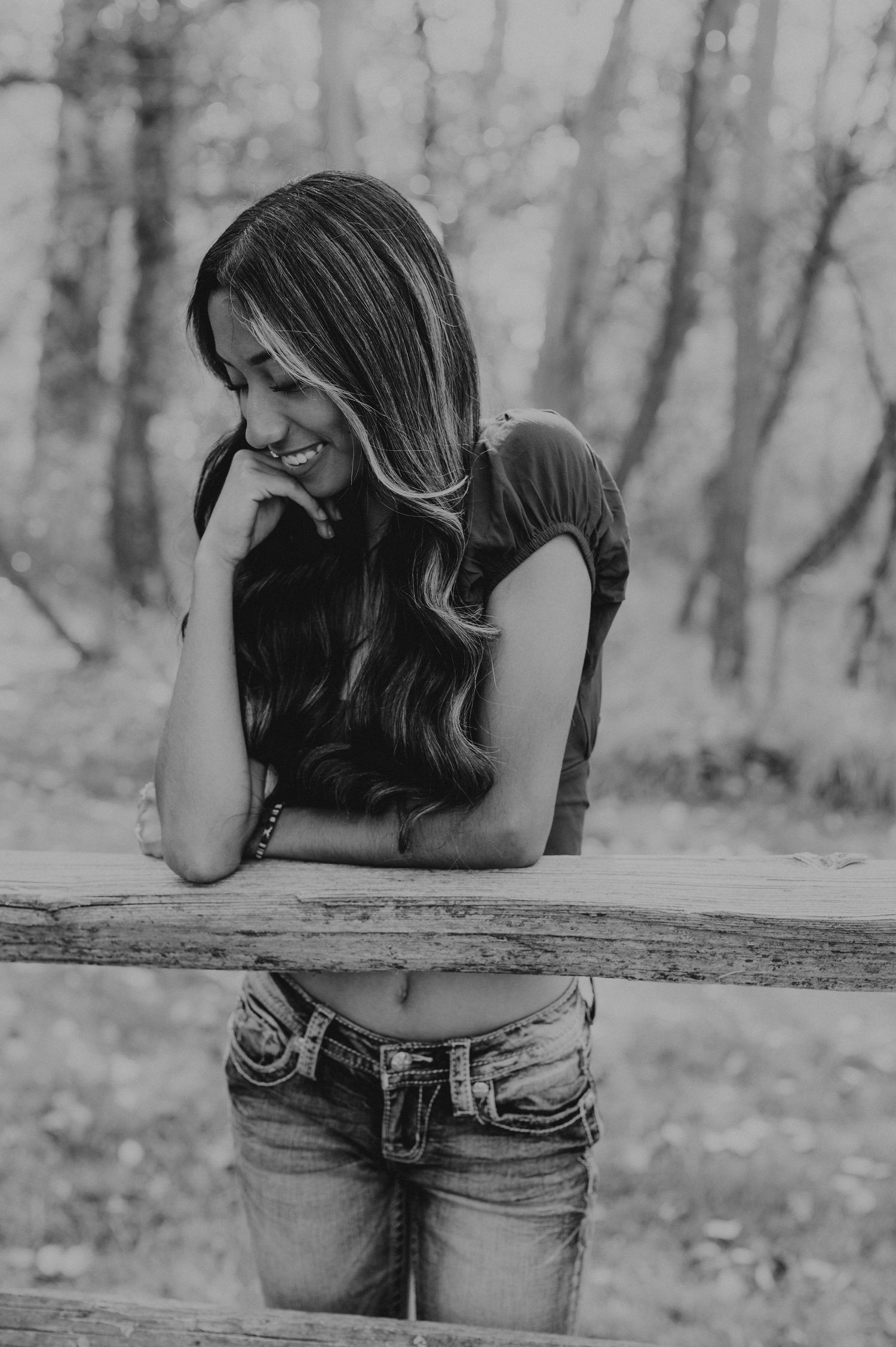 Girl leaning on a wood fence at the Whitman Mission