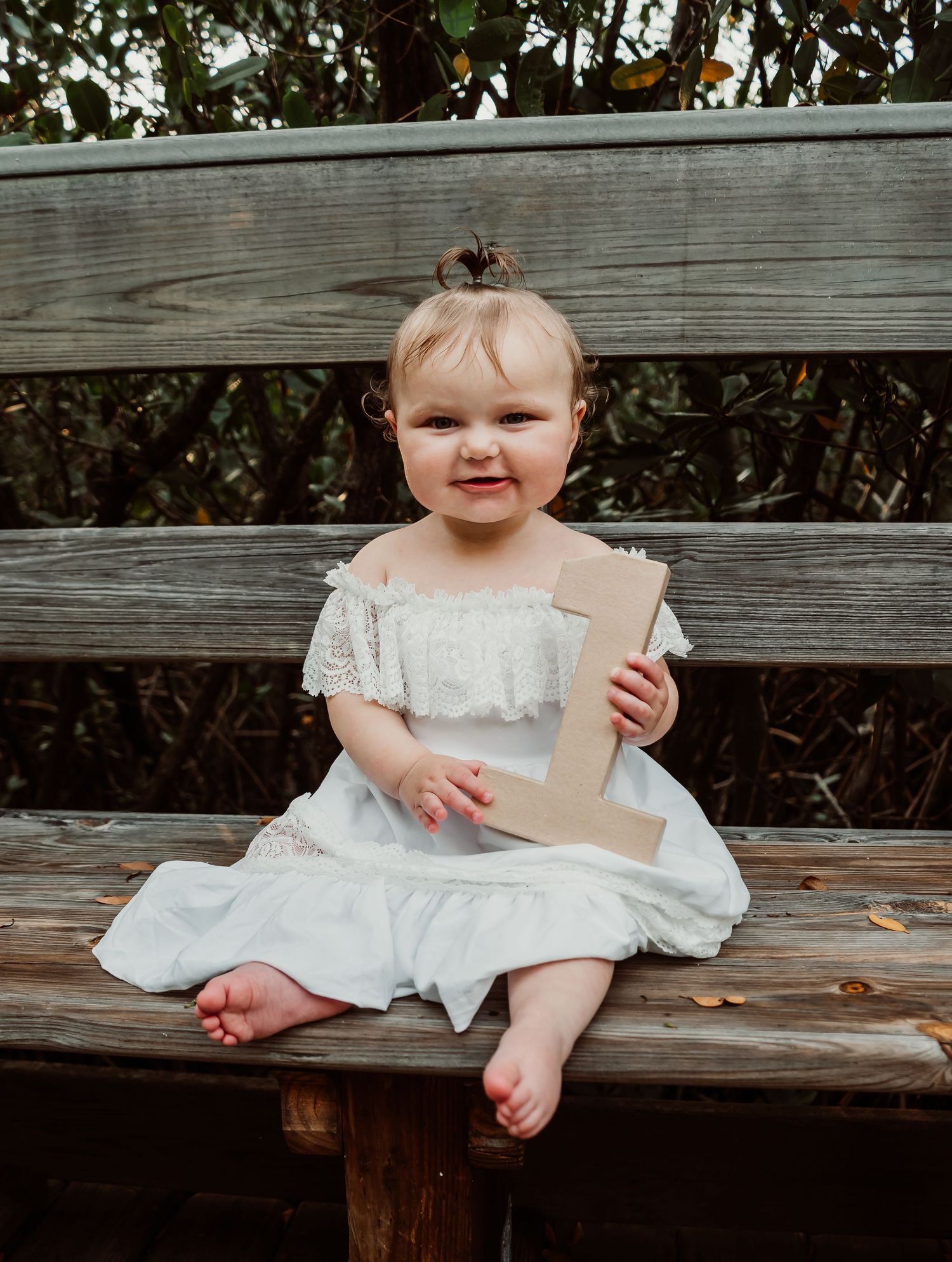 Outdoor Cake Smash Session at Indian Rocks Beach, Indian Rocks, FL; Baby holding a 1 sign