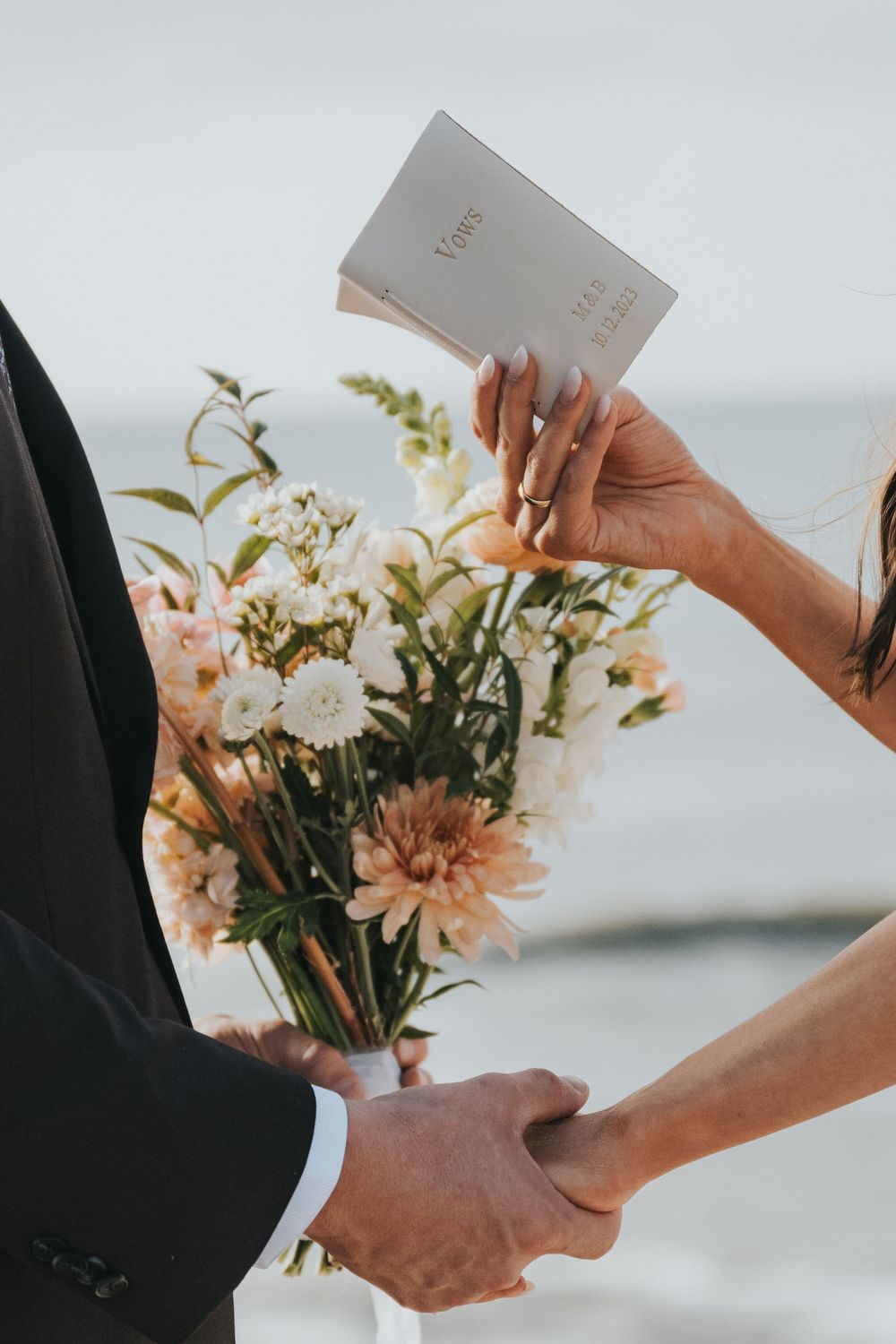 Up close details of a bride sharing her vows during her destination elopement in San Diego, CA