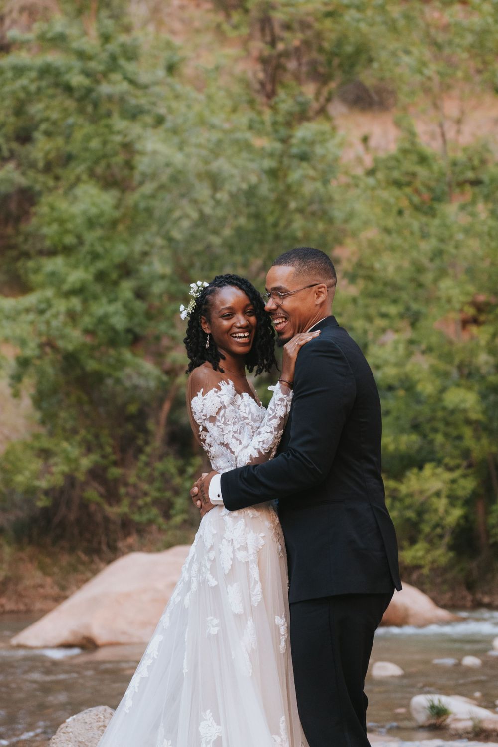 A couple embraces during their summer destination elopement in Zion National Park.