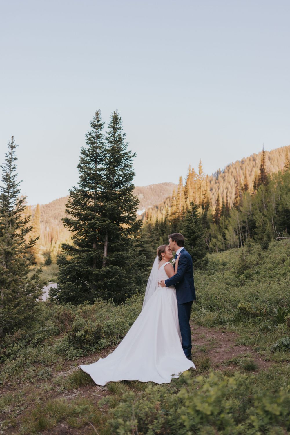 A couple embraces during their elopement near Salt Lake City Utah, captured by an affordable elopement photographer.