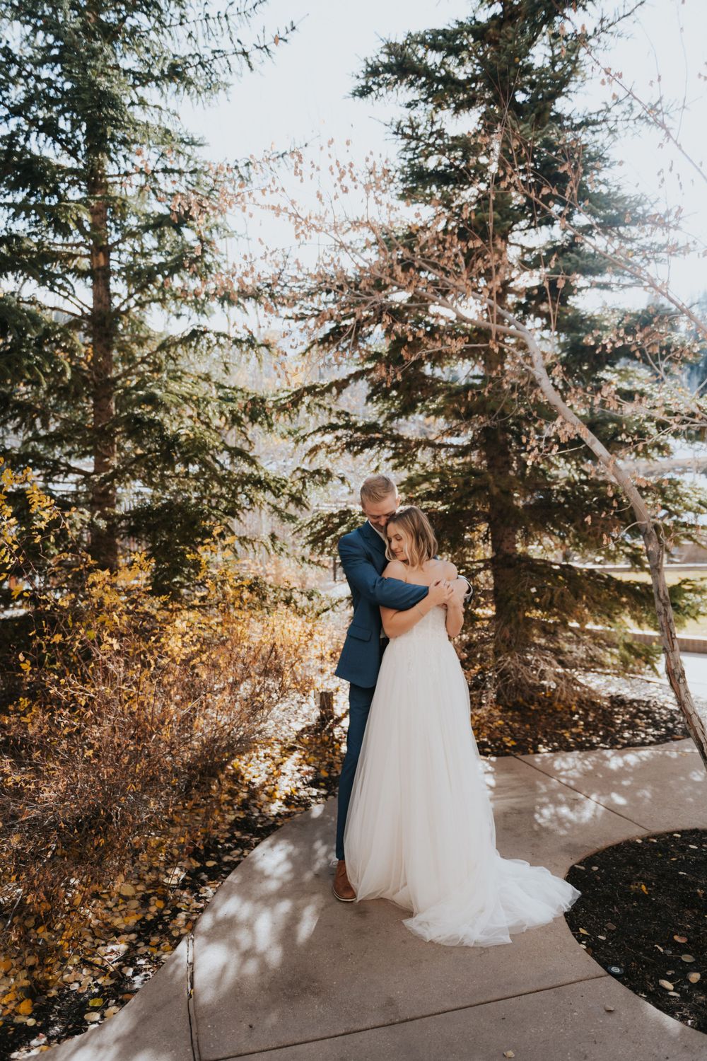 A couple embraces during their destination elopement to St Regis, Deer Valley in Park City, UT.