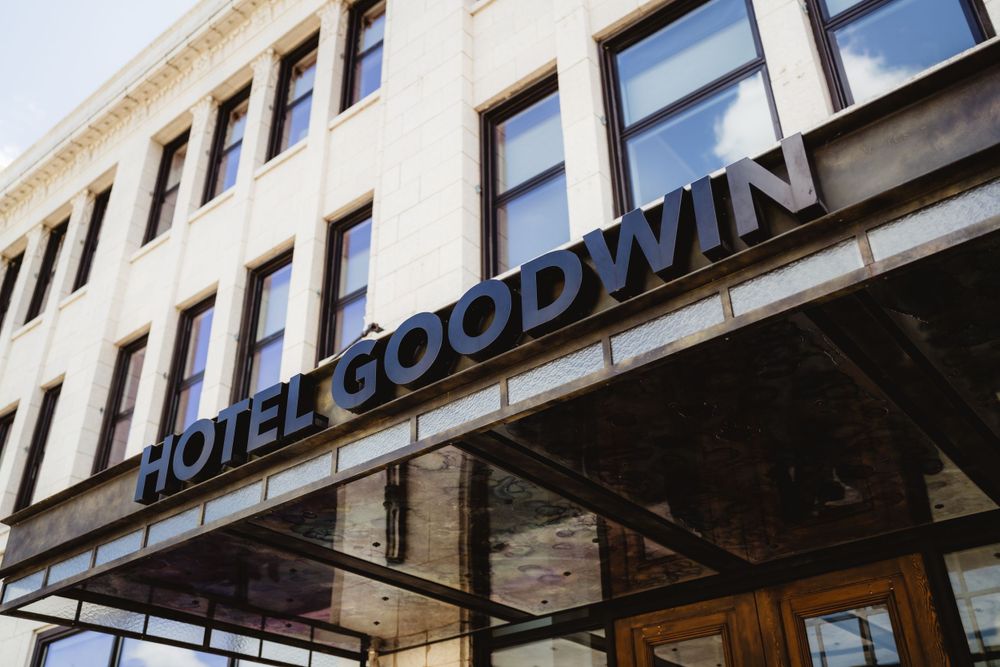 Exterior signage of Hotel Goodwin building with classic architectural details.