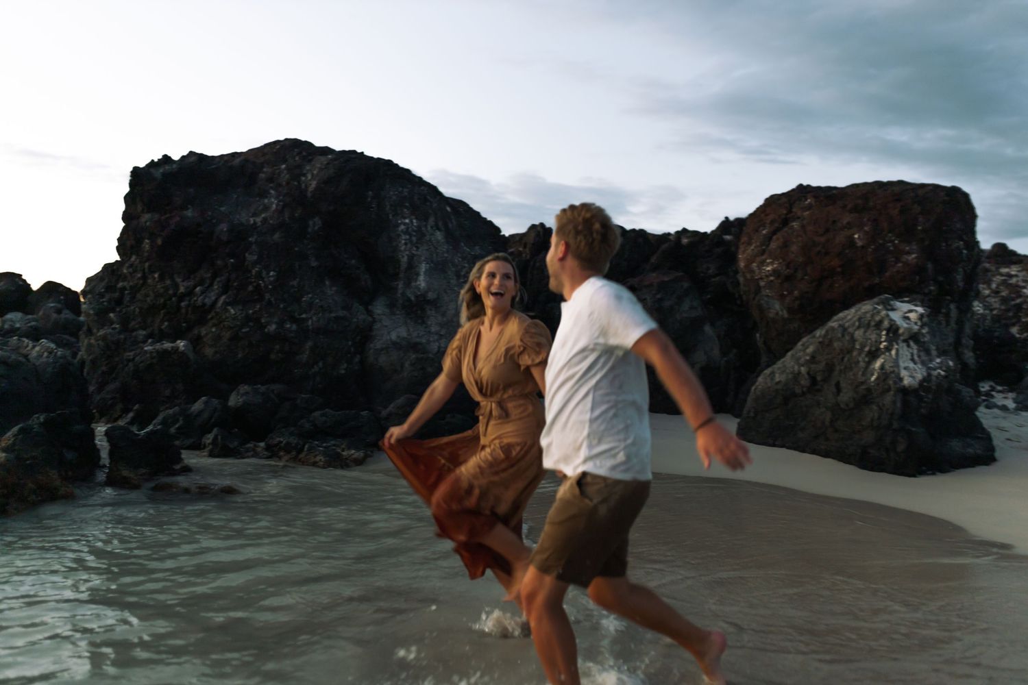 Couple running on the beach engagement photo Florida destination wedding