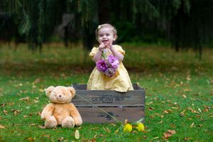 little girl standing in a box