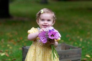little girl holding some flowers