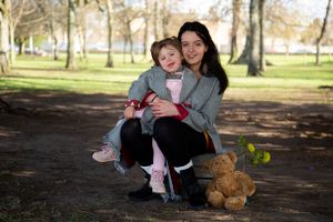 Mother and daughter together at park