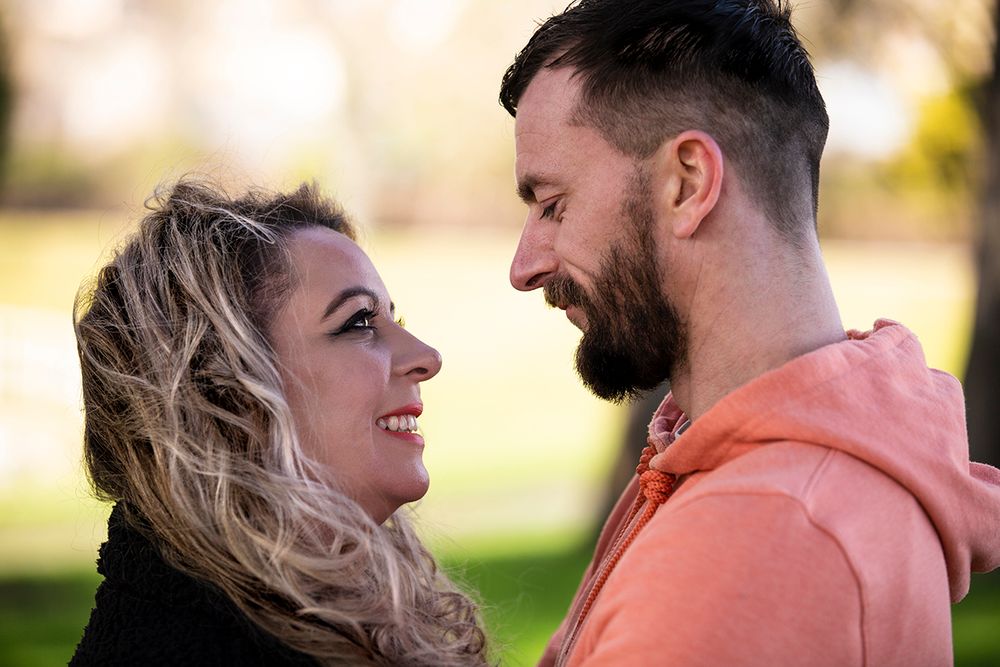 engaged couple looking at each other with love.