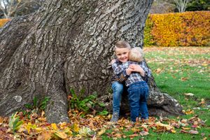 two boy sharing a hug in the park