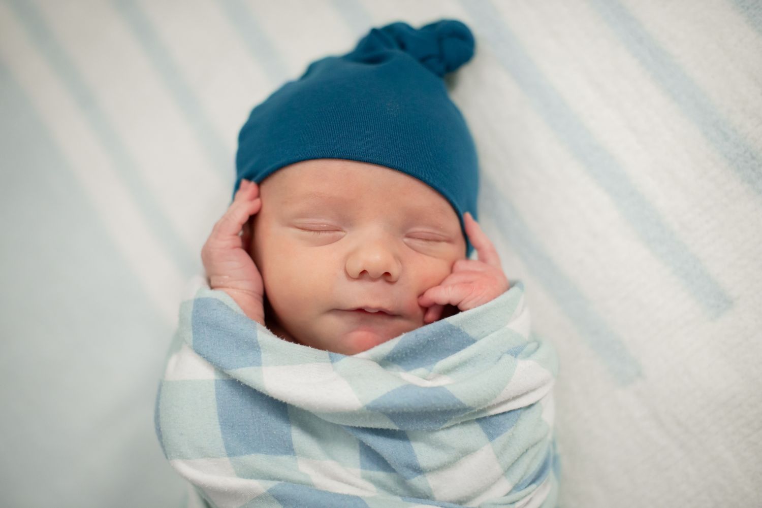 In-home lifestyle newborn family photo session by Wichita photographer
