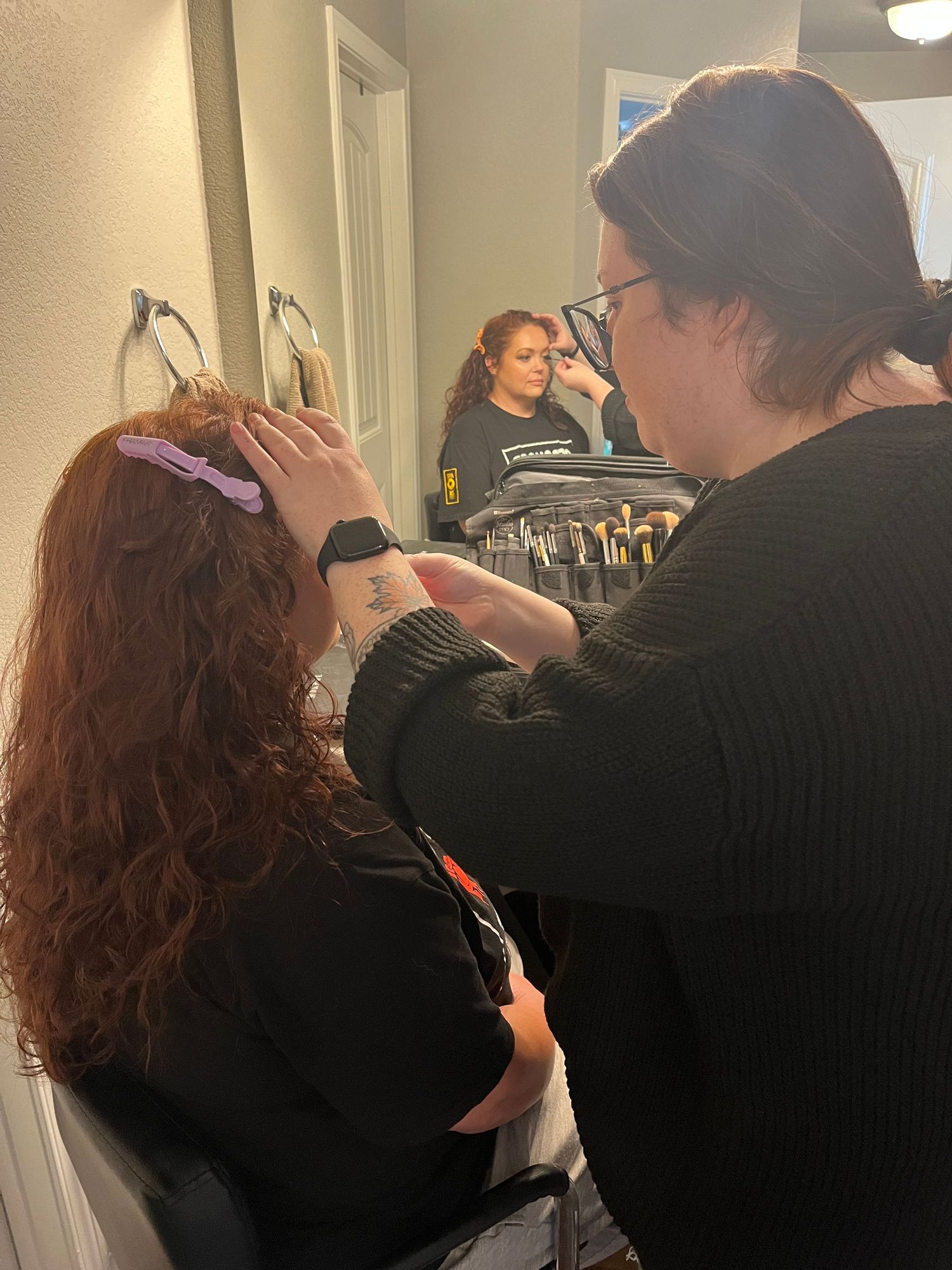 Red Headed Woman getting her make up done during a Boudoir Photo Shoot in Colorado Springs
