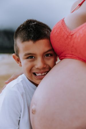 Series of joyful expressions and interactions between child and parent in warm lighting.