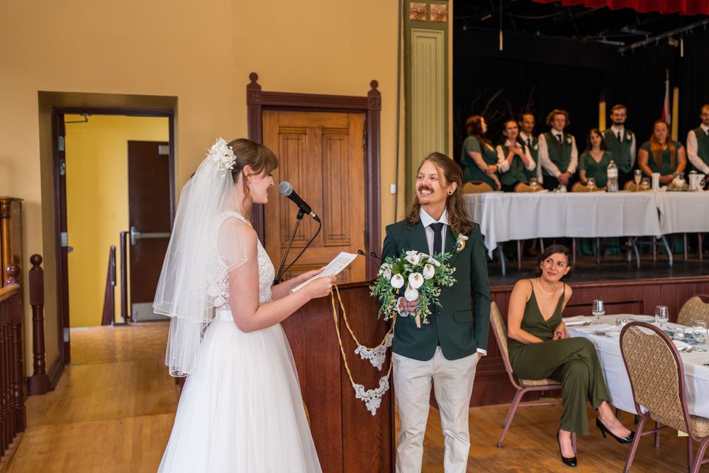 wedding ceremony vows bride and groom acton town hall interior