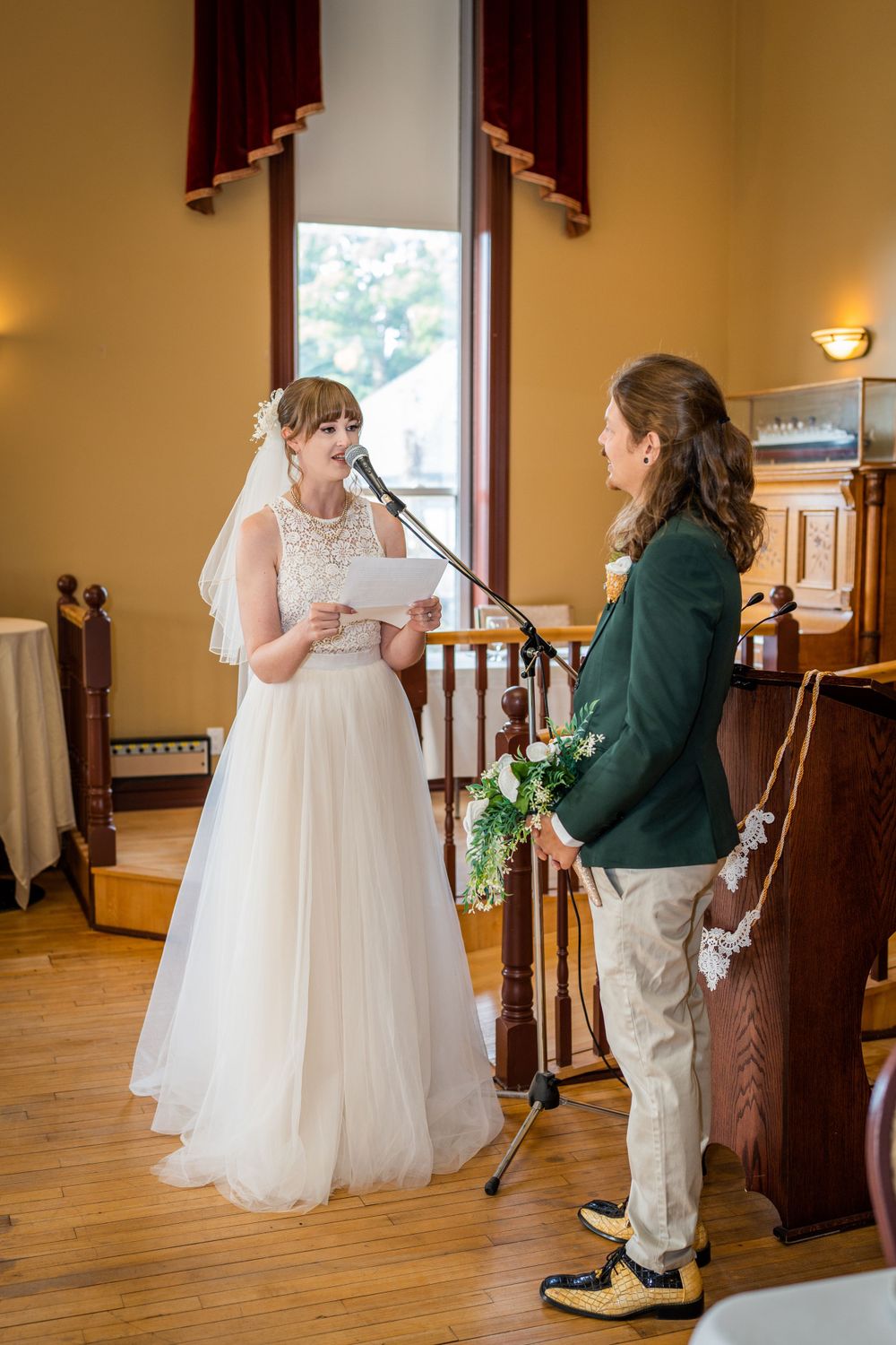wedding ceremony vows bride and groom acton town hall interior