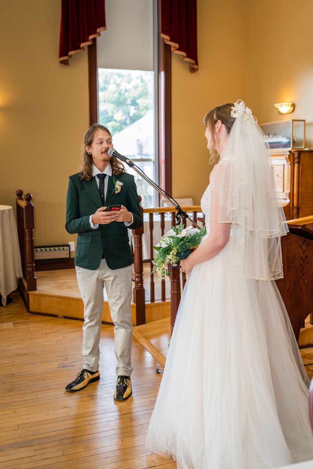 wedding ceremony vows bride and groom acton town hall interior