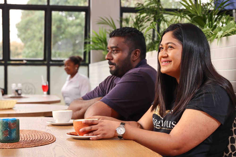 Friends enjoying meal together at restaurant table