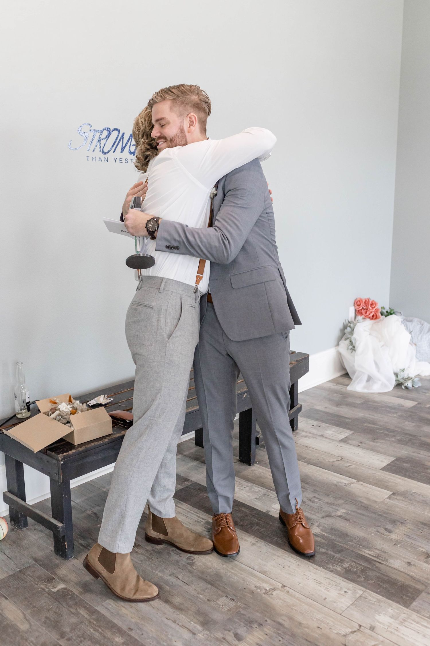 groom hugs brother in law