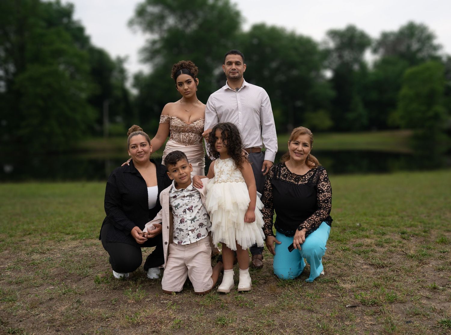 Family and friends gather for group photos in a natural outdoor setting.
